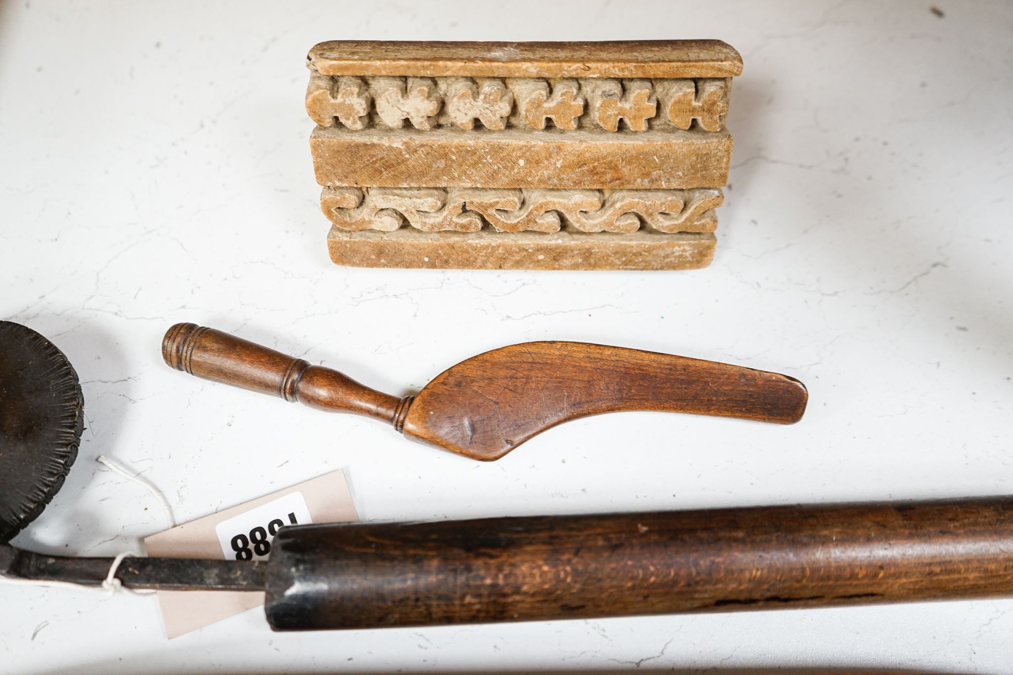 Three weaving shuttles, a crimper and two other items